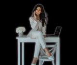 Business woman with brown hair sitting on her desk